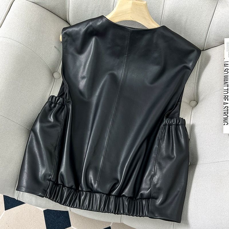 Black Sleeveless Jacket With Large Gold Buttons