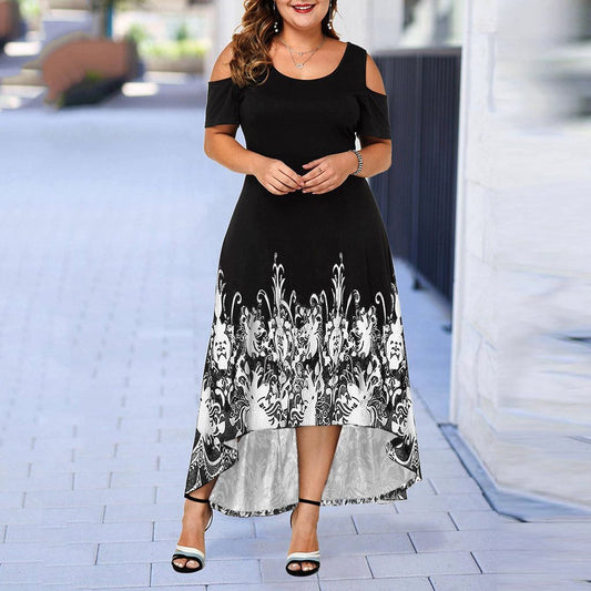 From view on a model: Bring some serious style to your wardrobe with our Women's Plus Size High-Low Midi Dress. The elaborate design at the base gives this dress a unique touch, while the round neckline and cut out at shoulders add to its chic and playful vibe. Perfect for any occasion, this dress will become your new favorite go-to!