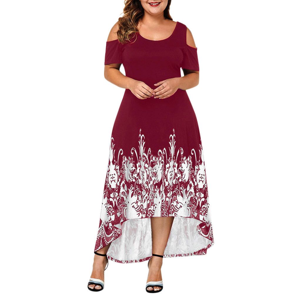 Front view on a model: Bring some serious style to your wardrobe with our Women's Plus Size High-Low Midi Dress. The elaborate design at the base gives this dress a unique touch, while the round neckline and cut out at shoulders add to its chic and playful vibe. Perfect for any occasion, this dress will become your new favorite go-to!