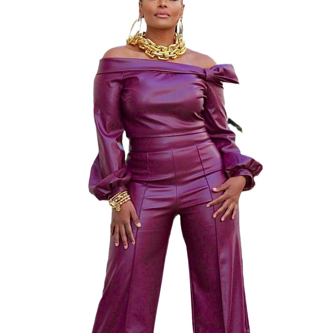 Front view of pants suit on a model: This faux leather pants suit offers a bold and trendy look for many occasions. The top features long sleeves that widen just before the cuffs for a unique touch. Its sleek design and comfortable fit provide the perfect balance of style and practicality.